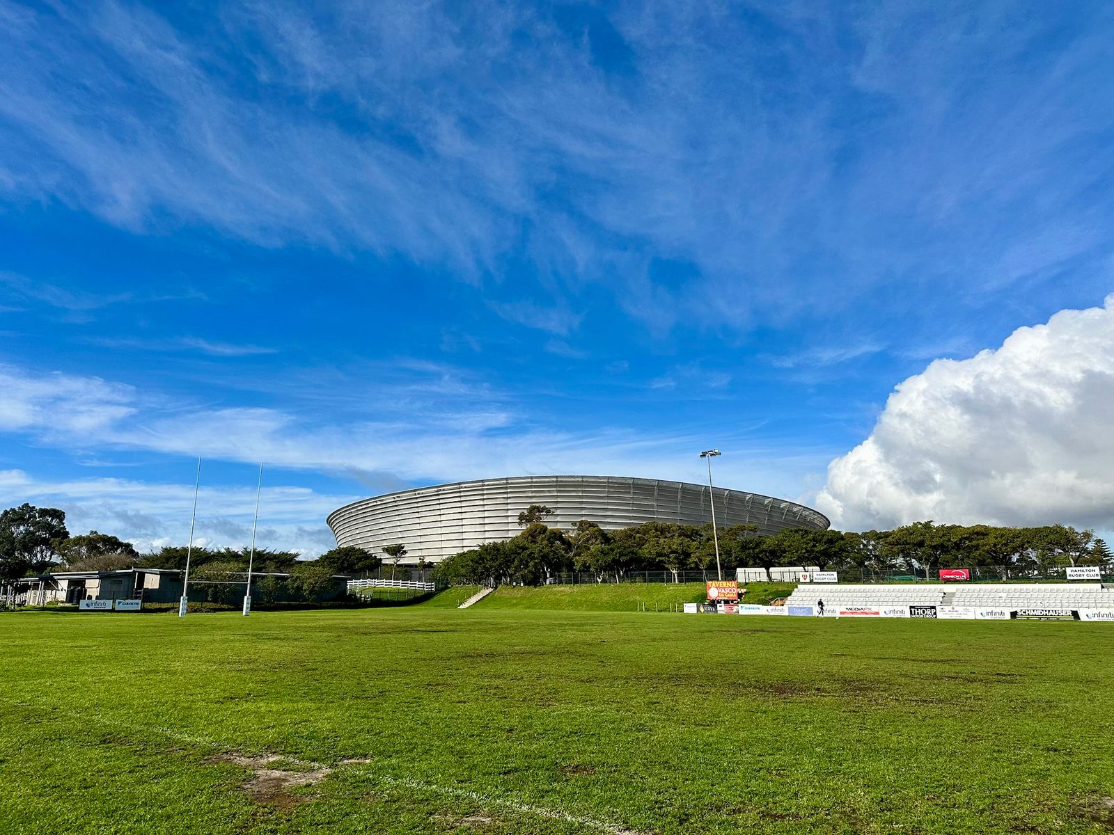 The rugby field at Hamilton Rugby Club, with Cape Town Stadium behind it.