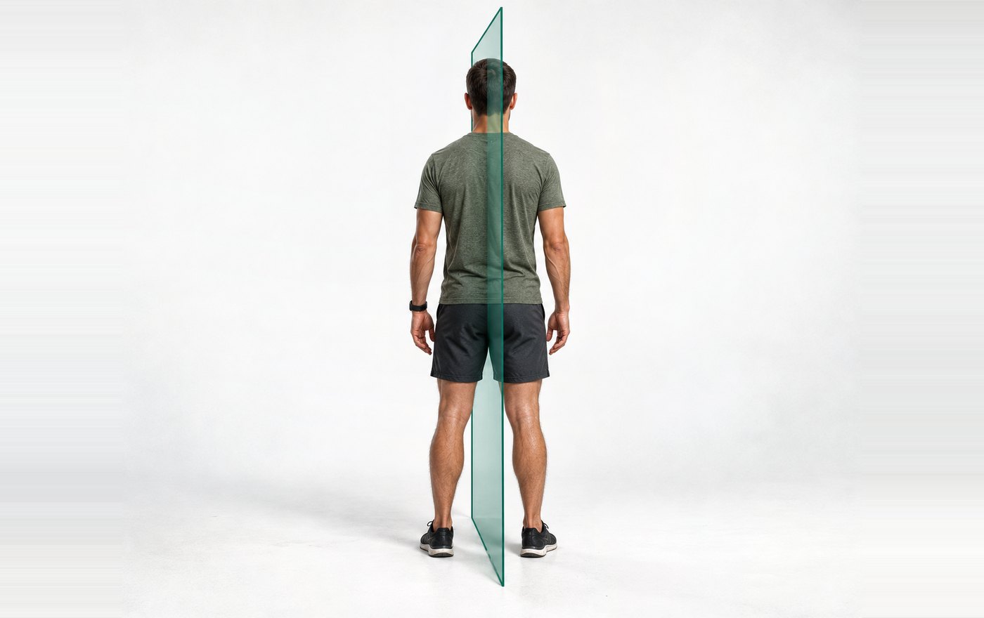 A person standing, with one vertical plane running front to back through the middle of the body.